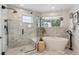 Elegant bathroom with walk-in shower, modern soaking tub, and stylish fixtures at 2244 S Lincoln St, Denver, CO 80210