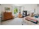 Bright bedroom featuring a plush beanbag, inviting bed, and natural light from a large window at 2244 S Lincoln St, Denver, CO 80210