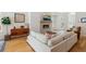 Bright and modern living room with fireplace, complemented by stylish furniture and natural light streaming in from large windows at 2244 S Lincoln St, Denver, CO 80210