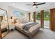 Comfortable primary bedroom with large bed, bedside tables, and balcony access with lovely outdoor views at 2244 S Lincoln St, Denver, CO 80210