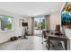 Versatile office space with natural light, workspace, and sliding glass doors to a balcony at 2244 S Lincoln St, Denver, CO 80210