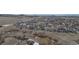 Expansive aerial view of a well-planned community surrounded by natural landscapes and rolling hills at 2578 Gray Wolf Pl, Castle Rock, CO 80104