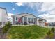 Charming backyard featuring a cozy patio, green lawn, and an inviting outdoor seating area at 2578 Gray Wolf Pl, Castle Rock, CO 80104