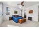Comfortable bedroom featuring a bed, windows, and neutral decor at 2578 Gray Wolf Pl, Castle Rock, CO 80104