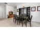Bright dining room with a black table and a decorative hutch at 2578 Gray Wolf Pl, Castle Rock, CO 80104