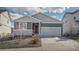 Charming single-Gathering home featuring a two-car garage and low maintenance front yard in a Gathering-friendly neighborhood at 2578 Gray Wolf Pl, Castle Rock, CO 80104