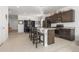 Modern kitchen featuring stainless steel appliances, a center island, and an adjoining dining area for easy entertaining at 2578 Gray Wolf Pl, Castle Rock, CO 80104