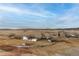 Scenic landscape view featuring a serene meadow with a small creek winding through snow-dusted ground at 2578 Gray Wolf Pl, Castle Rock, CO 80104