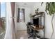 Home office setup with a modern desk, chair, and ample natural light at 2578 Gray Wolf Pl, Castle Rock, CO 80104