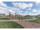 Community playground featuring a play structure nestled among landscaped areas and pathways at 2578 Gray Wolf Pl, Castle Rock, CO 80104