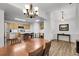 Open concept dining room and kitchen featuring sleek appliances, a central island, and ample counter space at 4251 S Blackhawk Cir # 3E, Aurora, CO 80014