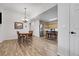 Open concept dining room and kitchen with hardwood floors and a view of the backyard at 4251 S Blackhawk Cir # 3E, Aurora, CO 80014