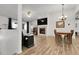 Cozy living room area with a fireplace, dining area, and ample natural light at 4251 S Blackhawk Cir # 3E, Aurora, CO 80014
