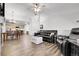 Cozy living room with hardwood floors, leather furniture, and an open-concept layout at 4251 S Blackhawk Cir # 3E, Aurora, CO 80014