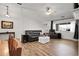 Bright living room featuring wood floors, leather furniture, and natural light at 4251 S Blackhawk Cir # 3E, Aurora, CO 80014