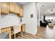 Bright office space with built-in desk, cabinets, and seamless flow to the living room at 4251 S Blackhawk Cir # 3E, Aurora, CO 80014
