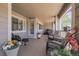 Spacious covered patio featuring comfortable seating, plants and outdoor living space at 4251 S Blackhawk Cir # 3E, Aurora, CO 80014