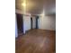Spacious finished basement with laminate flooring, stairs and neutral walls at 606 Tennyson St, Denver, CO 80204