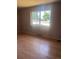 Bedroom featuring laminate floors and a large window to let in natural light at 606 Tennyson St, Denver, CO 80204