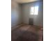 Bedroom featuring carpet, a window, and white walls at 606 Tennyson St, Denver, CO 80204