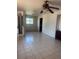 The living room has tile floors, and a ceiling fan with light at 606 Tennyson St, Denver, CO 80204