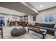 Finished basement with a bar, lounge area and modern design elements at 671 Green Mountain Dr, Erie, CO 80516