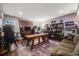 Spacious finished basement with dark wood floors and a stylish, modern decor at 671 Green Mountain Dr, Erie, CO 80516