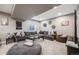Finished basement featuring a large sectional sofa and entertainment area at 671 Green Mountain Dr, Erie, CO 80516