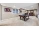 Finished basement with a pool table, recessed lighting, and bar in the background at 671 Green Mountain Dr, Erie, CO 80516