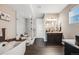 Modern bathroom featuring a glass enclosed shower, a soaking tub, and dark wood cabinets at 671 Green Mountain Dr, Erie, CO 80516
