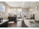 Bright bathroom with a soaking tub, glass shower, dark wood cabinets and an open doorway to a bedroom at 671 Green Mountain Dr, Erie, CO 80516