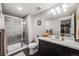 Contemporary bathroom featuring a tiled shower, modern vanity, and stylish fixtures at 671 Green Mountain Dr, Erie, CO 80516