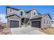 Attractive home featuring a two-car garage and appealing stone accents on the exterior at 671 Green Mountain Dr, Erie, CO 80516