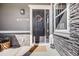 Charming front door featuring stone accents, 'Welcome' sign, and a decorative wreath at 671 Green Mountain Dr, Erie, CO 80516