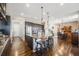 Open kitchen featuring a large island with seating, flowing into the dining area at 671 Green Mountain Dr, Erie, CO 80516
