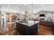 Spacious kitchen island connecting to dining and living rooms at 671 Green Mountain Dr, Erie, CO 80516