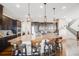 Well-lit kitchen featuring a large island with seating and modern appliances at 671 Green Mountain Dr, Erie, CO 80516