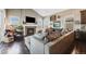 Inviting living room featuring a fireplace, hardwood floors, and ample natural light at 671 Green Mountain Dr, Erie, CO 80516
