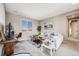 Cozy living room with a large window, comfortable seating, and neutral decor at 671 Green Mountain Dr, Erie, CO 80516