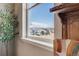 Scenic view from the window overlooking neighboring houses and snow-capped mountains on a clear day at 671 Green Mountain Dr, Erie, CO 80516