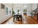 Elegant dining room with hardwood floors, ample natural light, and stylish decor at 7035 S Flower Ct, Littleton, CO 80128