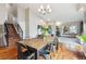 Dining room featuring hardwood floors, a wooden table, and easy access to the living area at 7035 S Flower Ct, Littleton, CO 80128