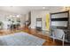 Open-concept living space with hardwood floors, high ceilings, and modern decor at 7035 S Flower Ct, Littleton, CO 80128