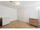 Versatile room with ample space features a freezer and cabinet, offering functionality and storage solutions at 7035 S Flower Ct, Littleton, CO 80128