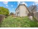 Exterior view of the back of the home and yard with a wooden fence at 8603 Barberry Pl, Parker, CO 80134