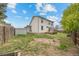 Exterior view of the back of the home and yard with a storage shed at 8603 Barberry Pl, Parker, CO 80134