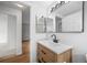 Modern bathroom with updated sink, vanity, and light fixture at 8603 Barberry Pl, Parker, CO 80134