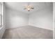 Bright bedroom features neutral carpet, a ceiling fan, and fresh paint at 8603 Barberry Pl, Parker, CO 80134