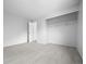 Spacious bedroom with neutral carpet, a closet with shelving, and fresh paint at 8603 Barberry Pl, Parker, CO 80134