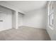 Clean, carpeted bedroom featuring closet organizers and a window at 8603 Barberry Pl, Parker, CO 80134